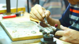 jeweler-repairing-jewelry-with-tools