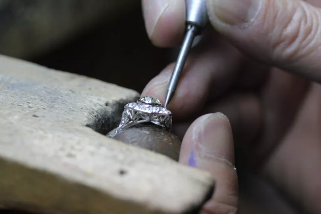 jeweler setting diamond