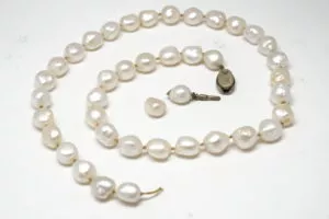 pearl necklace featuring knots between each pearl