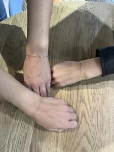 three-wrists-with-matching-gold-permanent-bracelets